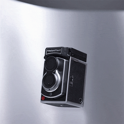 Opening the folding SX-70 camera
