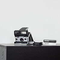 Polaroid  film camera with MiNT Flash Bar