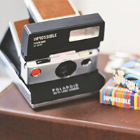 Polaroid SX-70 Model 1 instant film camera with MiNT Flash Bar